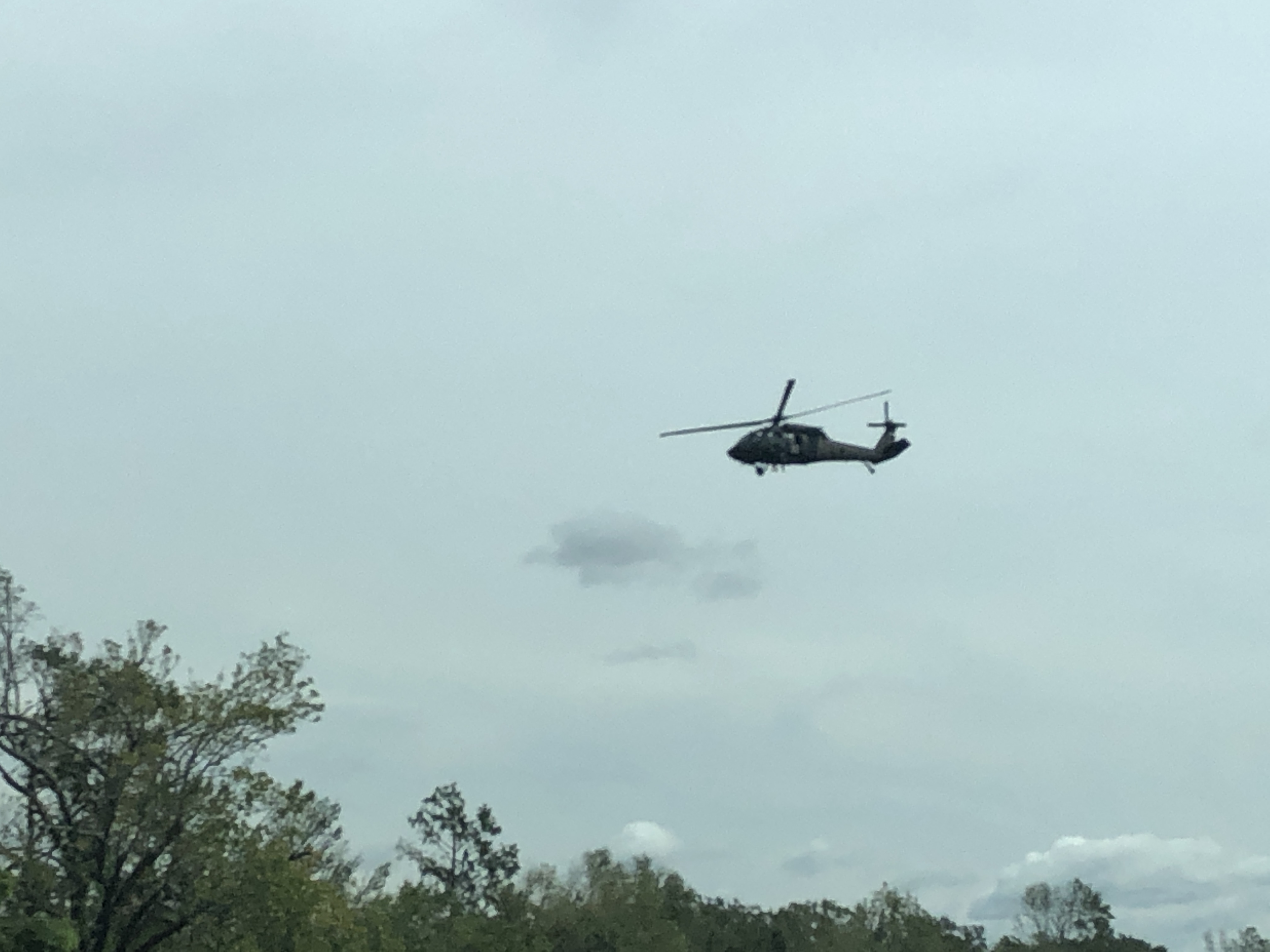 Orange Texas heavy damage.  Military helicopter circling water area.