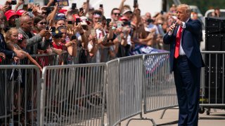 President Donald Trump talks to a crowd of supporters after arriving at Wilmington International Airport, Wednesday, Sept. 2, 2020, in Wilmington, N.C.
