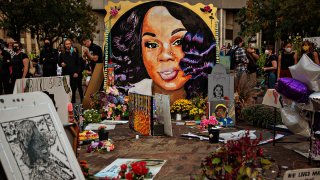 In this Sept. 26, 2020, file photo, people gather at a memorial for Breonna Taylor in downtown Louisville, Kentucky.