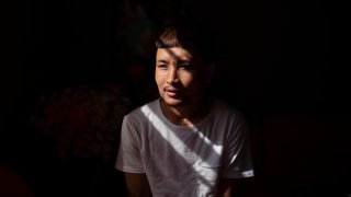 Bawi UK, 22, is photographed in his apartment in Providence, R.I., Saturday, Sept. 26, 2020. UK was a small child when his parents fled Myanmar, leaving him and his siblings to be cared for by their maternal grandmother. UK said the family suffered discrimination as Christians in a predominantly Buddhist nation. The military government was also trying to forcibly conscript his father. "To run for office, you had to be a Buddhist; to rent a house, you had to be Buddhist," said UK, a social work student at Rhode Island College and a youth leader at the Refugee Dream Center, an advocacy organization in Providence.