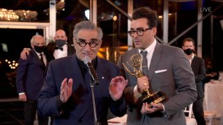 Eugene and Dan Levy accept an Emmy Award for their show "Schitt's Creek" at the "72nd Emmy® Awards."