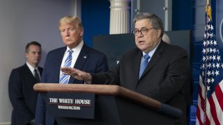 Attorney General William Barr, right, speaks as U.S. President Donald Trump listens during a Coronavirus Task Force news conference in the briefing room of the White House in Washington, D.C., U.S., on Monday, March 23, 2020. Trump said the U.S. economy cant remain slowed for too long to fight coronavirus, declaring the country "was not built to be shut down."