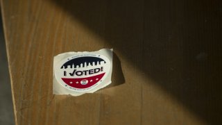 An "I Voted" sticker sits on a bench at a polling location in Brooklyn borough of New York, U.S., on Tuesday, June 23, 2020.