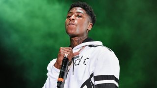 In this Aug. 25, 2018, file photo, NBA YoungBoy performs during Lil WeezyAna at Champions Square in New Orleans, Louisiana.