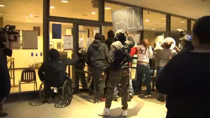Protesters stormed the door of the Fourth District police station in Northwest D.C. on Oct. 27, 2020.