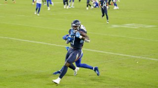 Tennessee Titans wide receiver A.J. Brown (11) catches a touchdown pass against the Buffalo Bills in the first half of an NFL football game Tuesday, Oct. 13, 2020, in Nashville, Tenn.