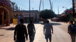 Expelled migrants walking in Tijuana, Mexico, Oct. 8, 2020.