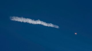 In this handout photo released by Roscosmos Space Agency, the Soyuz-2.1a rocket booster with Soyuz MS-17 space ship carrying a new crew to the International Space Station (ISS) blasts off at the Russian leased Baikonur cosmodrome, Kazakhstan, Wednesday, Oct. 14, 2020. A trio of space travelers has launched successfully to the International Spce Station, for the first time using a fast-track maneuver to reach the orbiting outpost in just three hours.