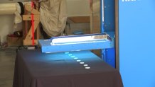 A California company has created a mobile device with special arms that extend outward with angled UV lamps to remove shadows for better coverage.
