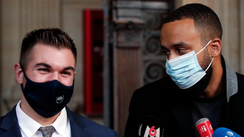 Alek Skarlatos, left, and Anthony Sadler, right, deliver a speech during the Thalys attack trial at the Paris courthouse, Friday, Nov. 20, 2020. Passengers who wrestled and disarmed an Islamic State gunman aboard a high-speed Amsterdam to Paris train are recounting how their split-second decisions helped prevent what could have become a mass slaughter.