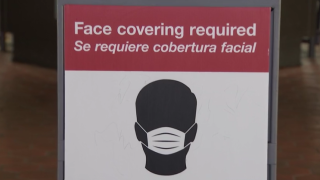 A sign at Metro tells riders that face coverings are required
