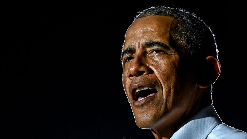 TOPSHOT - Former US President Barack Obama speaks at a drive-in rally as he campaigns for Democratic presidential candidate former Vice President Joe Biden in Miami, Florida on November 2, 2020.