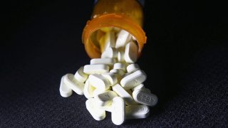 Opioid pills in a prescription bottle