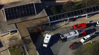 Emergency vehicles are shown outside the Glenmont Metro station.