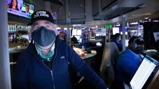 Traders work on the floor of the NYSE in New York.
