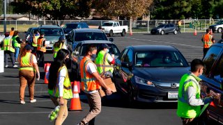 A drive-in “Let’s Feed LA County” food distribution event hosted by the Los Angeles Food Bank on Dec. 4, 2020 in Hacienda Heights, California.