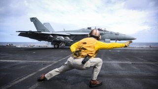 An F/A-18F Super Hornet launches from the aircraft carrier USS Theodore Roosevelt.