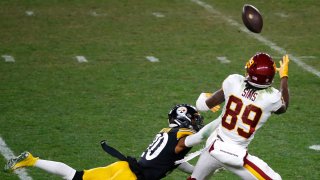 Cam Sims catches a pass against the Pittsburgh Steelers during the second half of their game at Heinz Field Dec. 7.