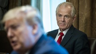 Peter Navarro, director of the National Trade Council, right, listens as U.S. President Donald Trump speaks during a meeting with executives of supply chain distributors in the Cabinet Room of the White House in Washington, D.C., U.S., on Sunday, March 29, 2020. Trump said his administration expects the peak of deaths in the U.S. coronavirus outbreak to be reached in about two weeks, and that he would extend current social distancing guidelines for Americans until April 30.