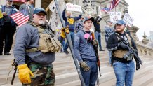 People take part in a protest for "Michiganders Against Excessive Quarantine" at the Michigan State Capitol in Lansing, Michigan on April 15, 2020.