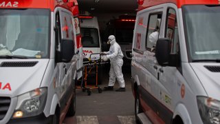 A patient arrives at the 28 de Agosto Hospital in Manaus, Amazon State, Brazil, on January 14, 2021, amid the novel coronavirus, COVID-19, pandemic. Manaus is facing a shortage of oxygen supplies and bed space as the city has been overrun by a second surge in COVID-19 cases and deaths.