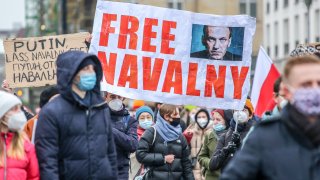 In this Jan. 23, 2021, file photo, protesters hold a banner reading "FREE NAVALNY" as some 2,500 supporters of Russian opposition politician Alexei Navalny march in protest to demand his release from prison in Moscow in Berlin, Germany.