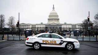A U.S. Capitol Police car drives past the U.S. Capitol in Washington, U.S., January 26, 2021.