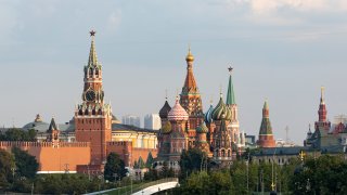 A view of the Kremlin with Spasskaya Tower and St. Basil's Cathedral in Moscow, Russia, early Saturday, June 20, 2020.