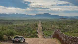 Border Patrol Agent watches along the Border near Sasabe Arizona. The border wall ends in this area. 4/29/2019