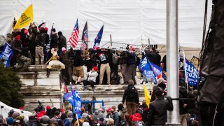 File - A group of pro-Trump protesters climb the walls of the Capitol Building on Jan. 6, 2021 in Washington, DC.