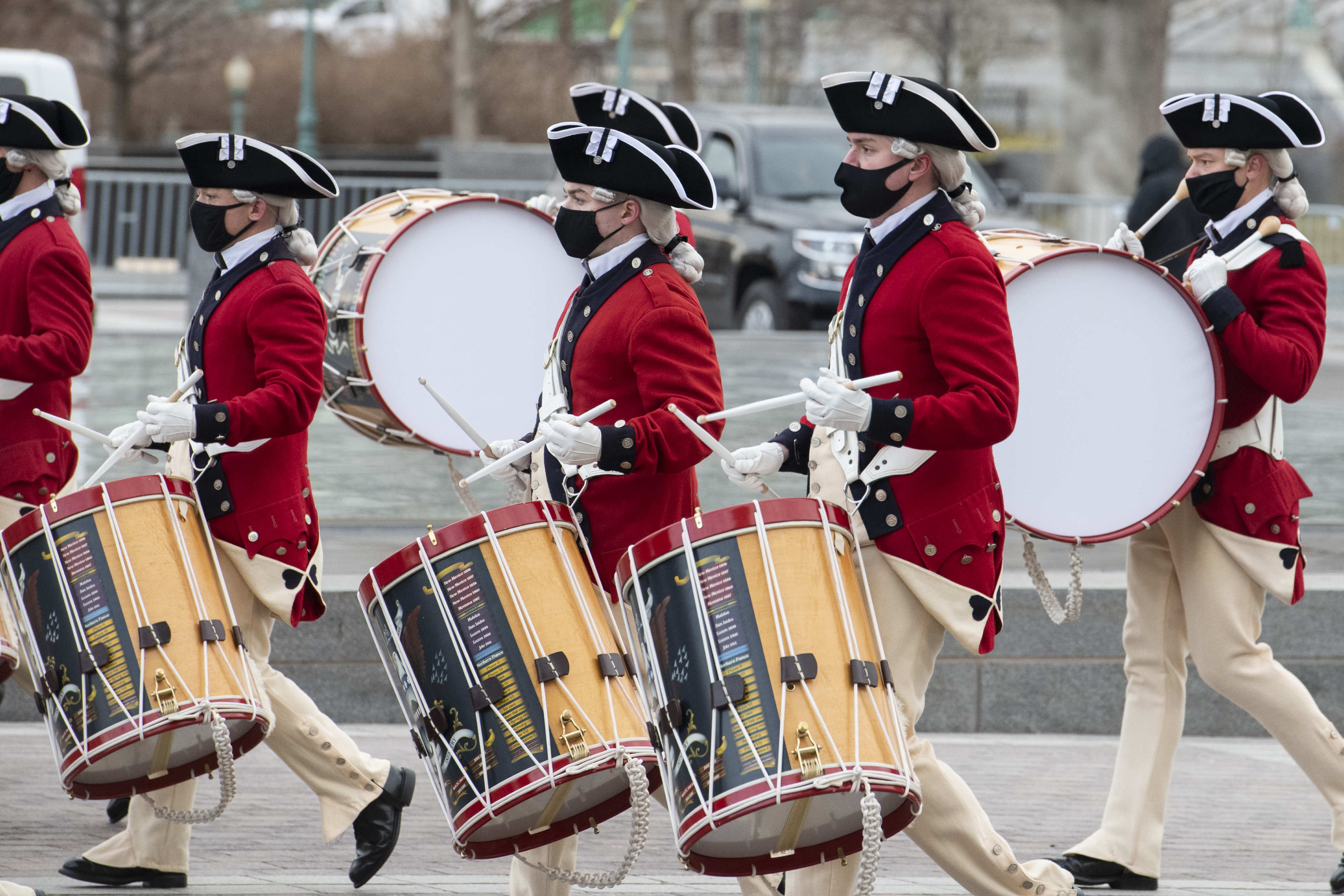 WASHINGTON, DC – JANUARY 18: A military band wearing period uniforms passes the East Front of the US Capitol during the dress rehearsal for the Inauguration of President-elect Joe Biden on January 18, 2021 in Washington, DC. The inauguration will take place on January 20. (Photo by Rod Lamkey-Pool/Getty Images)