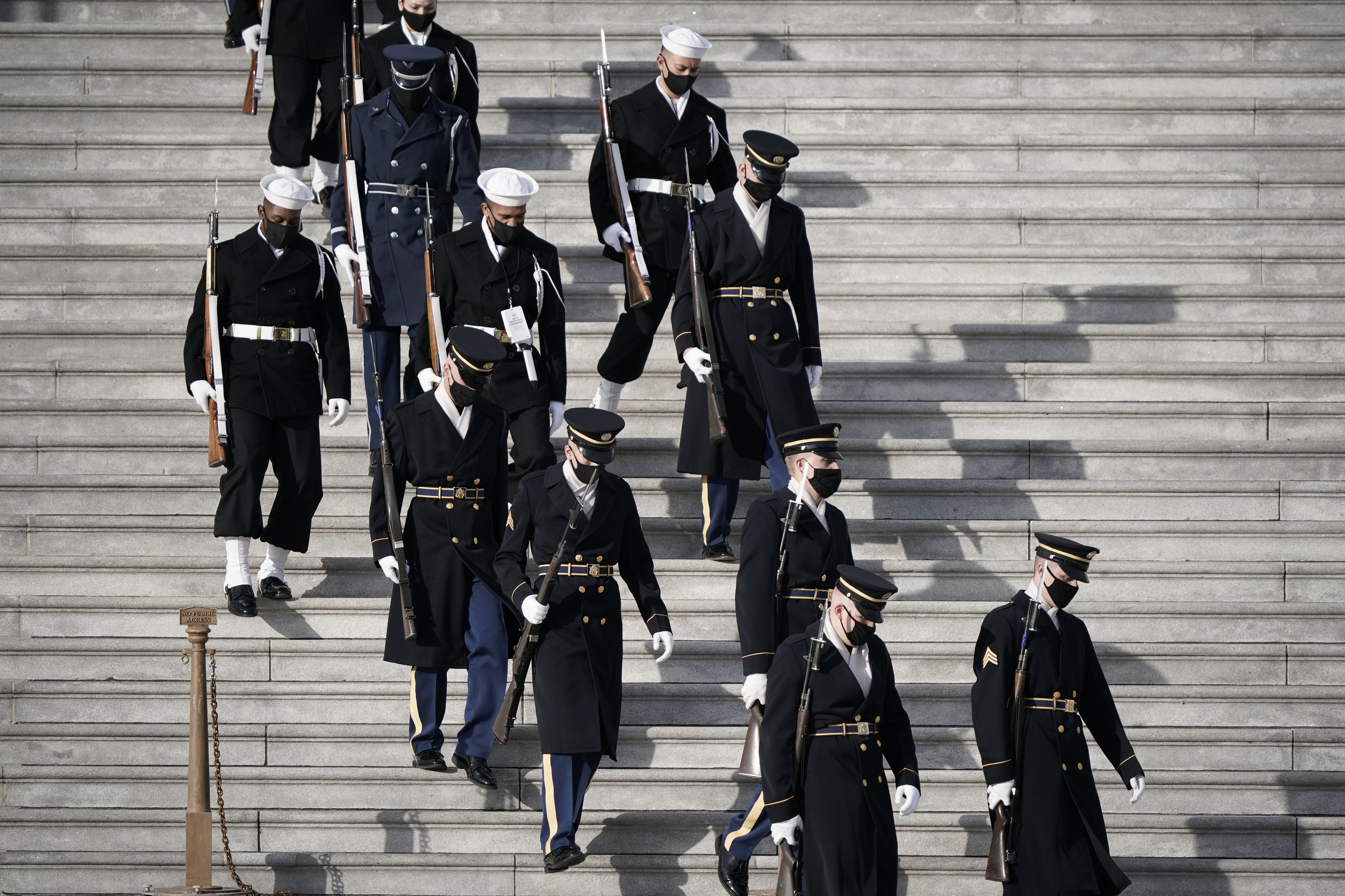 WASHINGTON, DC – JANUARY 18: U.S. military units walk down the steps of the U.S. Capitol before rehearsing for President-elect Joe Biden’s inauguration ceremony on January 18, 2021 in Washington, DC. The inauguration will take place on January 20. (Photo by J. Scott Applewhite-Pool/Getty Images)