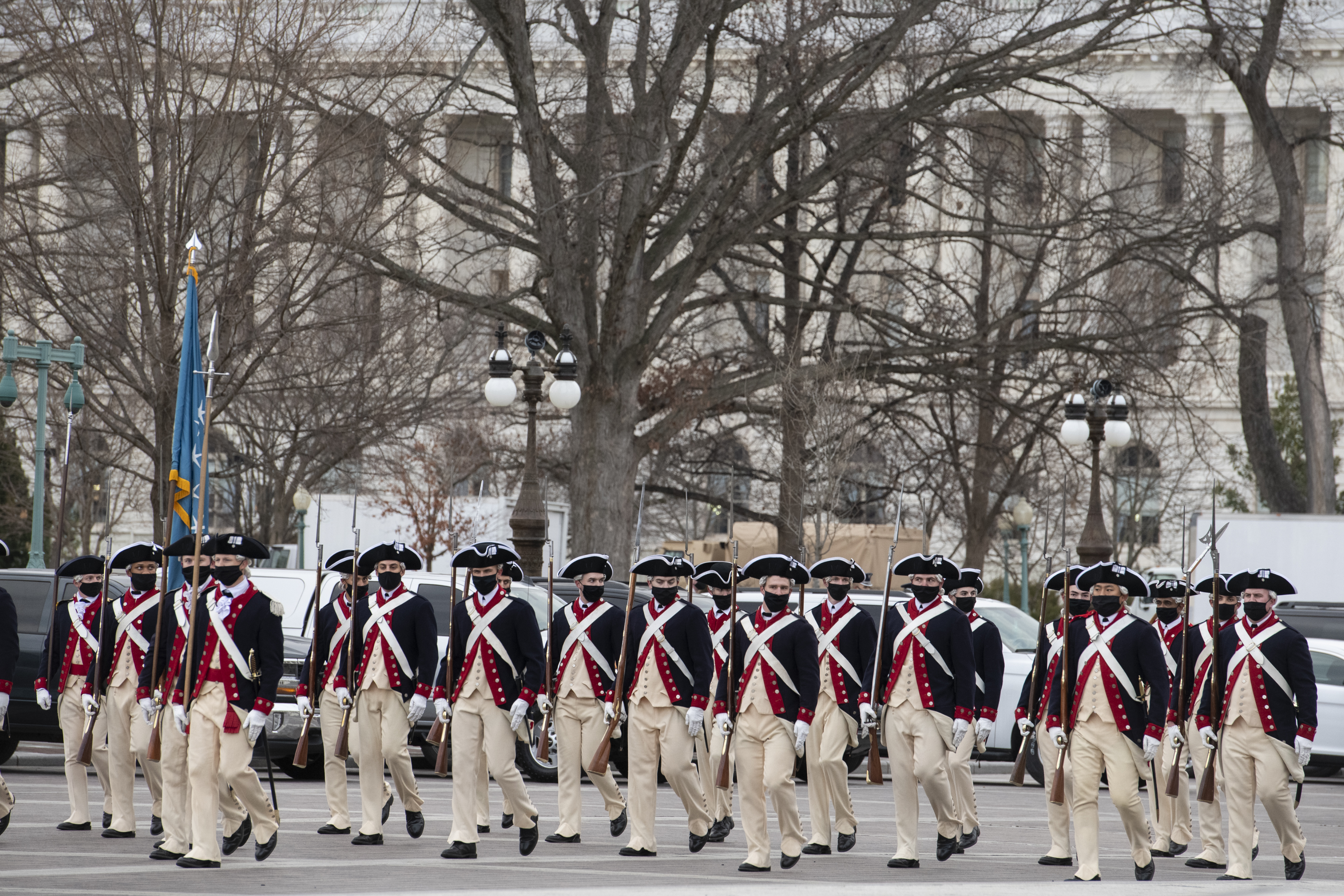 WASHINGTON, DC – JANUARY 18: Soldiers wearing period uniforms pass the East Front of the US Capitol during the dress rehearsal for the Inauguration of President-elect Joe Biden on January 18, 2021 in Washington, DC. The inauguration will take place on January 20. (Photo by Rod Lamkey-Pool/Getty Images)