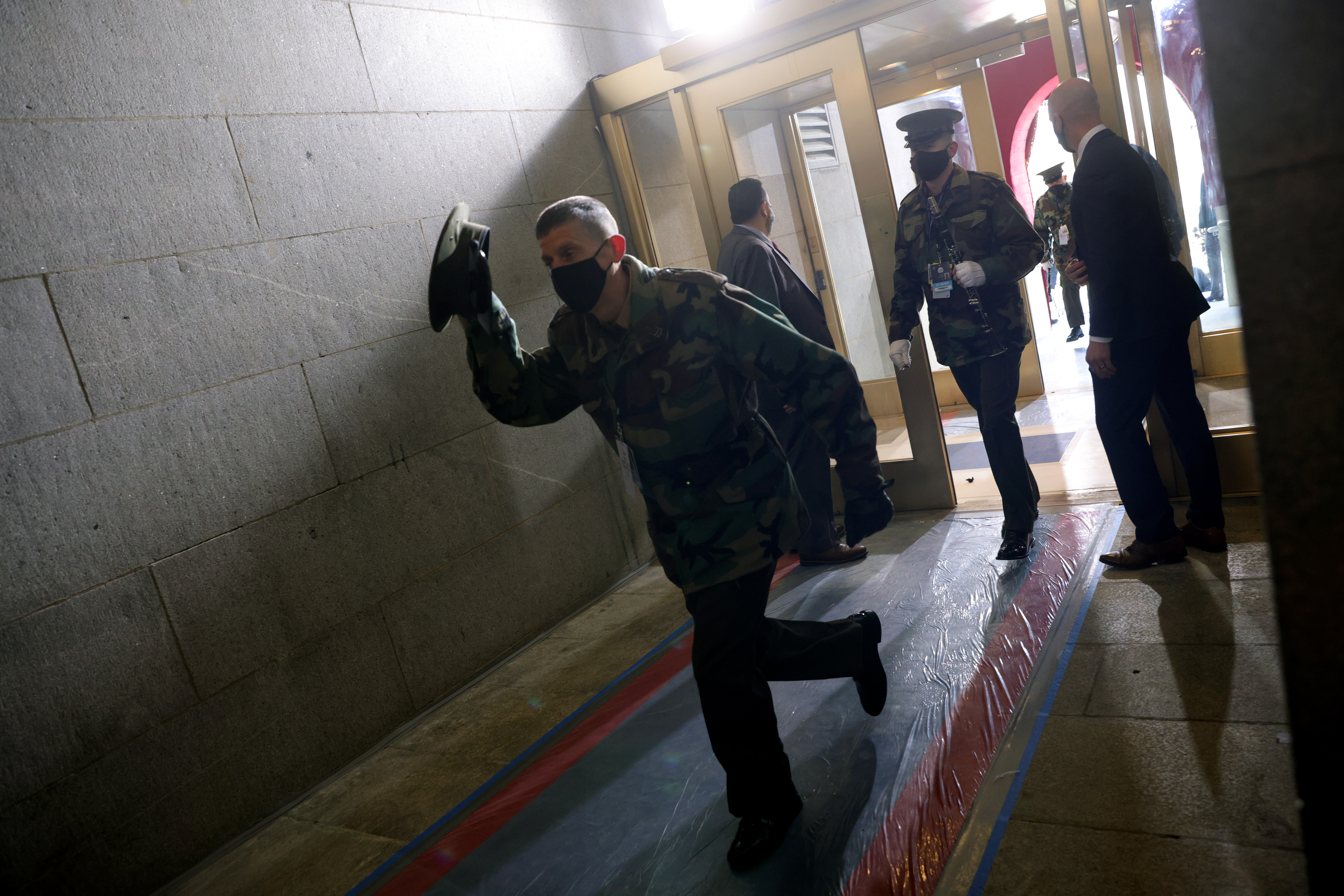 WASHINGTON, DC – JANUARY 18: People are evacuated back inside after an “external security threat” prior to a dress rehearsal for the 59th inaugural ceremony for President-elect Joe Biden and Vice President-elect Kamala Harris at the U.S. Capitol on January 18, 2021 in Washington, DC. Biden will be sworn-in as the 46th president on January 20th.  (Photo by Win McNamee/Getty Images)