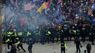 Police hold back supporters of US President Donald Trump as they gather outside the US Capitol’s Rotunda on Jan. 6, 2021, in Washington, DC.