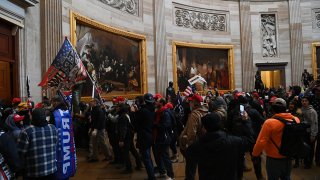 In this Jan. 6, 2021, file photo, supporters of President Donald Trump enter the U.S. Capitol's Rotunda.