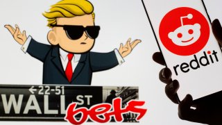 The Reddit logo is seen on a smartphone in front of a displayed Wall Street Bets logo in this illustration taken January 28, 2021.