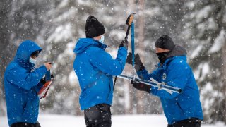 Officials conduct a snow survey in the Sierra Nevada.