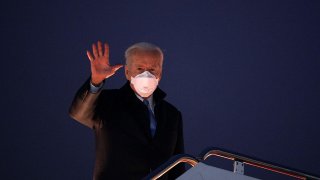 US President Joe Biden waves as he boards Air Force One before departing from Andrews Air Force Base in Maryland on February 12, 2021.