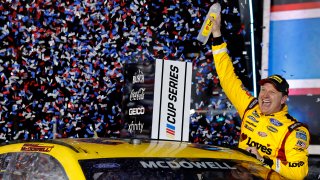 Michael McDowell, driver of the #34 Love's Travel Stops Ford, celebrates in victory lane after winning the NASCAR Cup Series 63rd Annual Daytona 500 at Daytona International Speedway on February 14, 2021 in Daytona Beach, Florida.