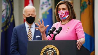 House Speaker Nancy Pelosi, a Democrat from California, wear protective masks while speaking during an event in the Rose Garden of the White House in Washington, D.C., on Friday, March 12, 2021.
