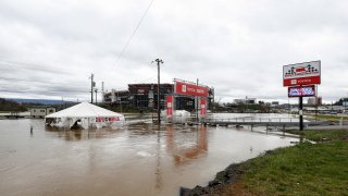 Water floods the vendor area as races for both the Truck Series and NASCAR Cup Series auto race were postponed due to inclement weather at Bristol Motor Speedway, Sunday, March 28, 2021, in Bristol, Tennessee.