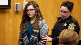 FILE - In this Dec. 21, 2017, file photo, Anissa Weier, one of two Wisconsin girls who tried to kill a classmate to win favor with a fictional horror character named Slender Man, is led into Court for her sentencing hearing, in Waukesha, Wis. Weier, is scheduled to appear Wednesday, March 10, 20201, before the Waukesha County Circuit Court judge who earlier sentenced her to 25 years in a mental health institution and ask for her conditional release.
