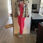 Amy Aiello Lofgren spent several days planning out her pink ensemble with sparkly silver sneakers to wear to her vaccination appointment.
