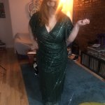 Actress Ashlie Atkinson wore a sequined, floor-length gown for her first vaccine appointment.