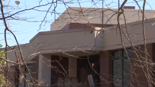 The burglary and sexual assault suspect fell five floors from this rooftop onto the patio of a resident before he died. As seen on NBC Washington on March 3, 2021.