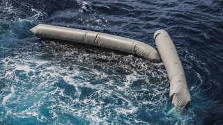 Debris from a dinghy which was supposedly carrying over 100 migrants are seen floating in the Mediterranean Sea northeast of the Libyan capital, Tripoli, Thursday, April 22, 2021. SOS Mediterranee, which operates the rescue vessel Ocean Viking, said late Thursday that the wreck of a rubber boat, which was initially carrying around 130 people, was spotted in the Mediterranean Sea. The aid vessel did not find any survivors, but could see at least ten bodies near the wreck, the group added in a statement.