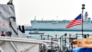 In this file photo, a US Navy patrol ship guards US and coalitions ships docked at the US 5th Fleet Command in Bahrain's capital Manama on December 17, 2019.