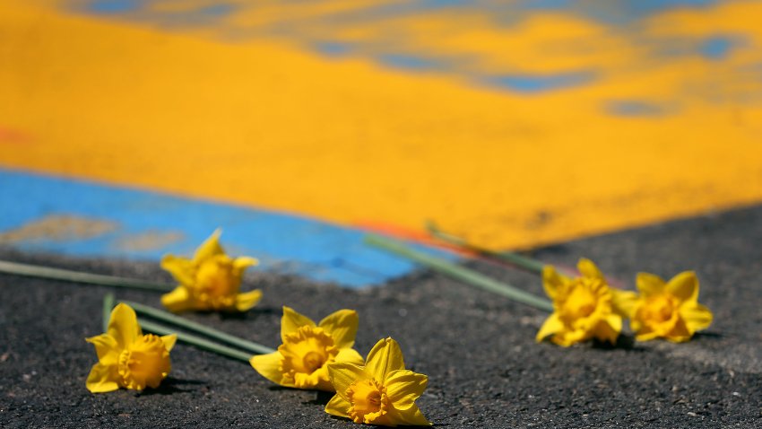 BOSTON, MA – APRIL 15: Daffodils are placed at the Boston Marathon finish line in Boston on April 15, 2020. One Boston Day is the seventh anniversary of the Boston Marathon Bombings, and the area around the finish line on Boylston St. is empty due to coronavirus. (Photo by John Tlumacki/The Boston Globe via Getty Images)