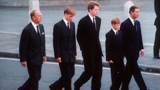 The Duke of Edinburgh, Prince William, Earl Spencer, Prince Harry and the Prince of Wales follow the coffin of Diana, Princess of Wales in September 1997